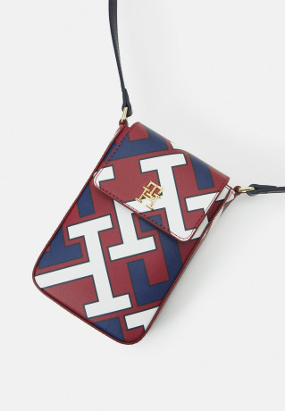 Tommy Hilfiger ICONIC PHONE POUCH MONO Phone case corporate mix ICONIC PHONE POUCH MONO Чехол для телефона корпоративный микс