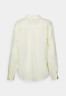 Tommy Hilfiger RELAXED LONG Button-down blouse lemon RELAXED LONG Блузка на пуговицах лимон