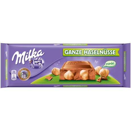 Milka Ganze Haselnusse Альпийский молочный шоколад с лесным орехом  300г