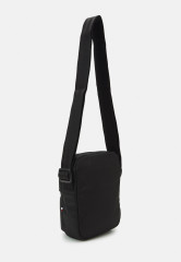 Tommy Hilfiger SKYLINE MINI REPORTER UNISEX Across body bag black SKYLINE MINI REPORTER UNISEX Сумка через плечо черный