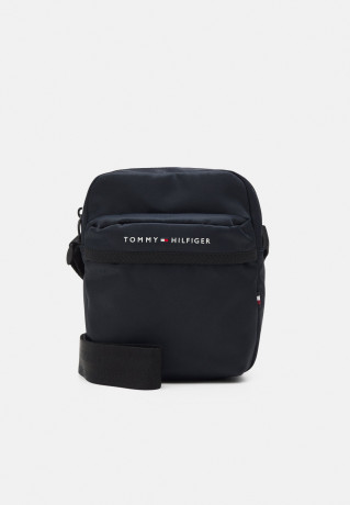 Tommy Hilfiger SKYLINE MINI REPORTER UNISEX Across body bag space blue SKYLINE MINI REPORTER UNISEX Сумка через плечо космический синий
