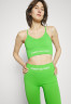 Tommy Hilfiger ESSENTIALS LOW SEAMLESS BRA Light support sports bra spring lime ESSENTIALS LOW SEAMLESS BRA Спортивный бюстгальтер с легкой поддержкой весенняя известь