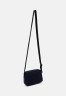 Tommy Hilfiger MODERN UTILITY REPORTER UNISEX Across body bag space blue MODERN UTILITY REPORTER UNISEX Сумка через плечо космический синий