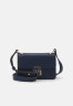 Tommy Hilfiger PUSHLOCK MINI CROSSOVER Across body bag space blue PUSHLOCK MINI CROSSOVER Сумка через плечо космический синий