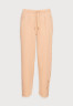 Tommy Hilfiger RELAXED LONG PANT Tracksuit bottoms beige RELAXED LONG PANT Спортивные штаны бежевый