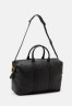 Tommy Hilfiger PREMIUM DUFFLE UNISEX Holdall black СУМКА PREMIUM DUFFLE UNISEX дорожная сумка черный