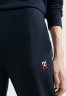 Tommy Hilfiger TAPERED MONOGRAM Tracksuit bottoms desert sky TAPERED MONOGRAM Спортивные брюки небо пустыни