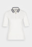 Tommy Hilfiger SLIM COLLAR ZIP Polo shirt ecru SLIM COLLAR ZIP Рубашка поло экрю