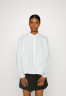 Tommy Hilfiger CO SOLID RAGLAN Button-down blouse optic white CO SOLID RAGLAN Блузка на пуговицах оптический белый