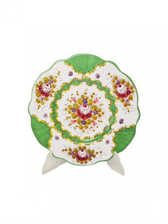 Тарелка винтажная декоративная Im Stil von Italy с округлым цветочным декором, в зеленовато-красных тонах, с фигурным краем, керамика, ручная роспись, 25.5 см, Италия, 1960-70гг.