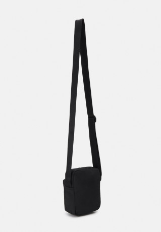 Tommy Hilfiger SKYLINE MINI REPORTER UNISEX Across body bag black SKYLINE MINI REPORTER UNISEX Сумка через плечо черный
